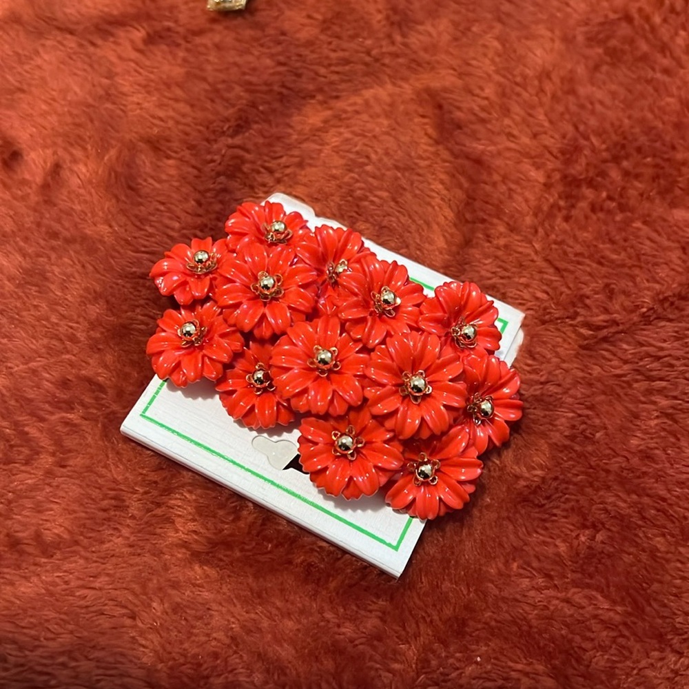 A pair of life giving coral colored flowered earrings!